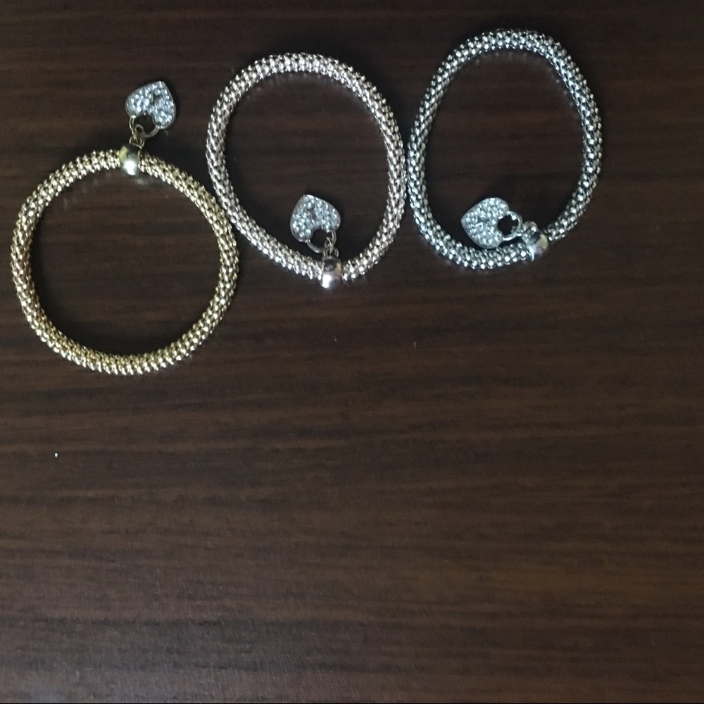 Three Bracelets (2 gold and 1 silver)
